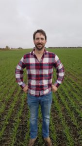 Ashton Trawin standing in a winter triticale crop